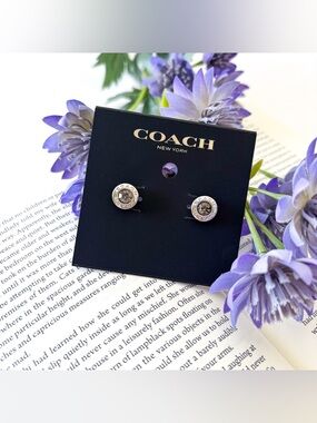 Coach open circle studs.